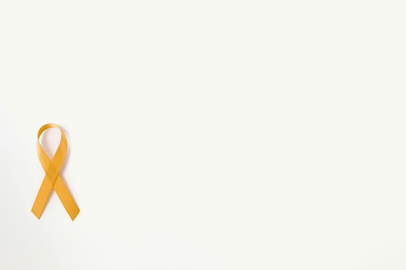 Person Holding Yellow and Orange Plastic Pack